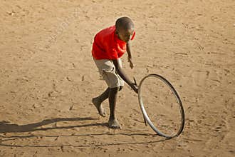 Teenage Boy Playing with Wheel - Landscape