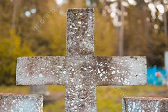 autumn cobweb on the grave cross on halloween