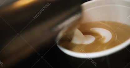 Barista making a coffee latte art
