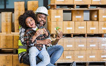 Single African father worker, hug his son, holding cup coffee, burger, having lunch together, happy smiling, taking break, work in