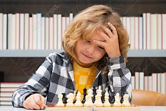 Clever thinking child. Chess for intelligent kid. Child genius, smart pupil playing logic board game. Clever school boy