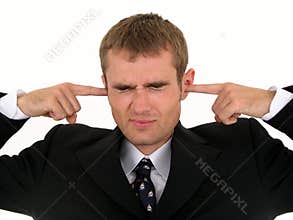 Businessman Putting Fingers in Ears