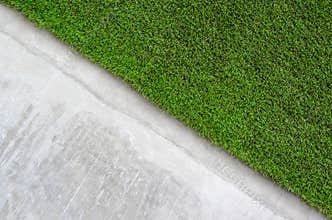 Artificial grass on a cement wall