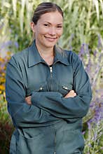 photo smiling woman gardener arms crossed