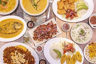 Latin cuisine dishes, fish cooked with coconut, stir-fried rice, ceviche with popcorn, patacones with sauces, fried yucca