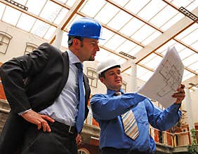 Businessmen Studying Blueprint
