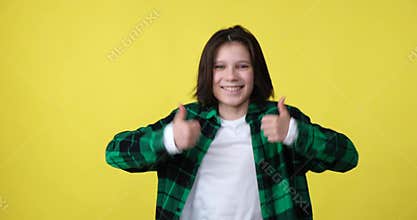 Boy expressing approval with thumb up