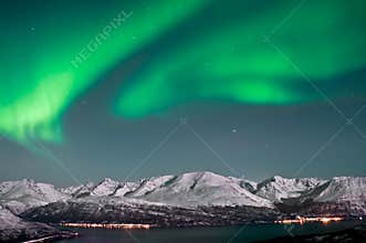 Northern lights above fjords in Norway