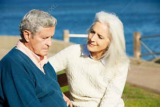 Senior Woman Comforting Depressed Husband