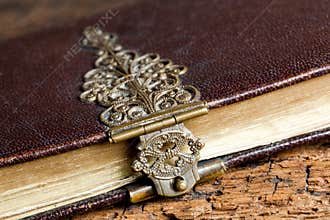 Dusty lock on ancient book