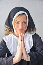 Nun praying to the Almighty