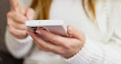 Woman celebrating winning bid or getting ecommerce shopping offer on smartphone