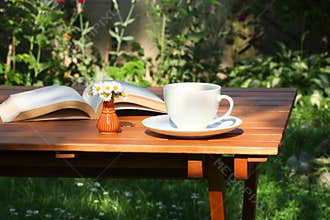 Coffee and book in garden