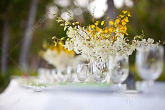 Beach wedding decor table setting and flowers