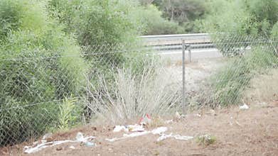 Roadside with garbage on the road in Spain