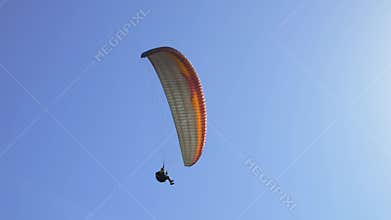 Paragliding on the background of blue sky. Live a healthy life. Be H3althy