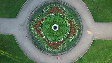 Children on scooters ride in a circle drone