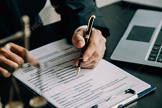 Judge gavel with Justice lawyers having team meeting at law firm background. Concepts of Law and Legal services