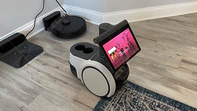 An Amazon Astro Robot moving around in a house