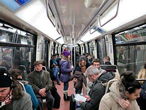 People in subway train wagon interior