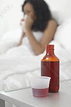 Cough Medicine In Front Of Sick Woman