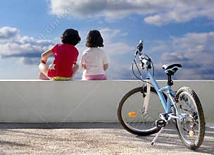 Two children and bicycle