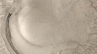 Micro view of a chemical reaction under a microscope with bubbles bursting on a loop