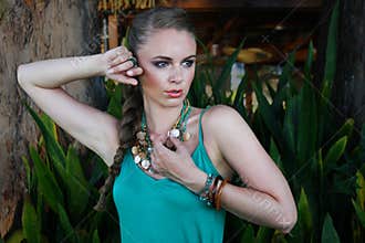 Portrait of pretty woman in tropical environment