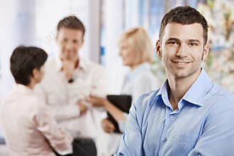 Happy businessman in office