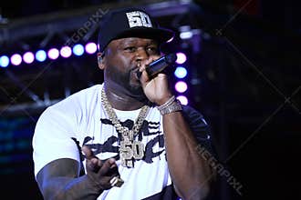Portrait of famous American rapper 50 Cent while holding the microphone close to his mouth