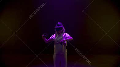 Neon girl playing vr game in headset closeup. Beautiful millennial using console