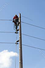 Electricians working on a pylon