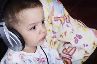 Little boy watching cartoons before bedtime