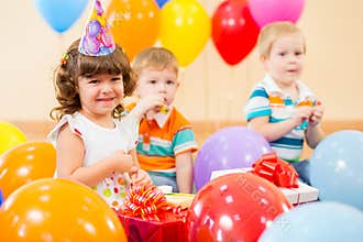 Happy children with gifts on birthday party