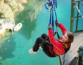 Bungy Jumping off Bridge in Extreme Swing on Lake