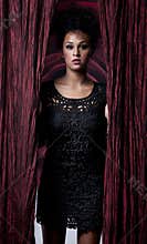 Glamorous woman in black dress