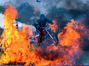 Stuntman jumps motorbike through fire explosion