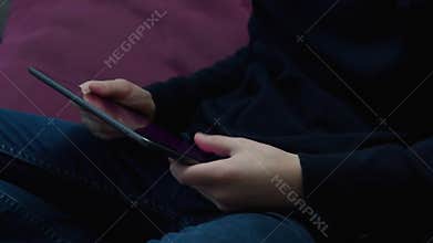 Male hands using digital tablet, business work and surfing net. Mobile app and market places. Online game entertainment
