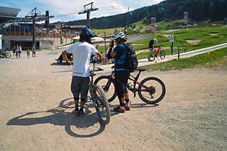 Downhill Mountainbikers Waiting