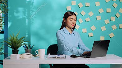 Happy businesswoman imputing data