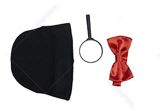 Black hat, magnifying glass, and red bow tie