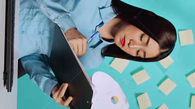 Happy businesswoman imputing data