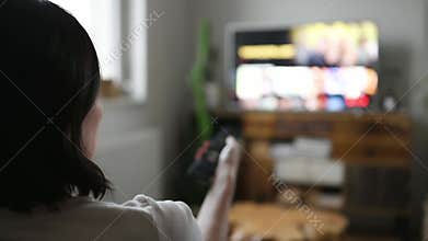 Woman watching smart TV at home