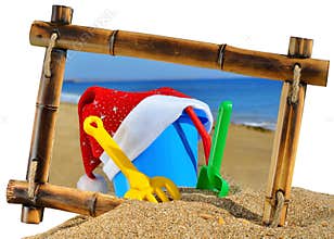 Childrens toys and Santas hat in bamboo frame