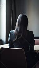 Back view of a woman in a suit waiting for a job interview, generated AI