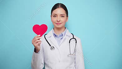 Female doctor cardiologist showing heart symbol