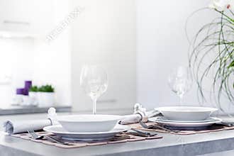 Set of dinner plates in modern kitchen