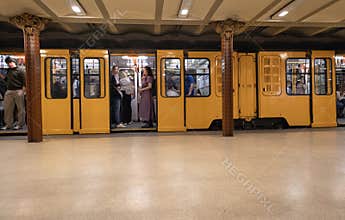 Yellow subway train at underground station in Budapest, Hungary