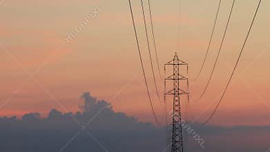 Electrical tower with clouds move and sunset