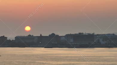 Stunning aerial sunset to night transition over Turkler in Alanya, Turkey. Alanya coastline,resorts,marina,hotels and city lights